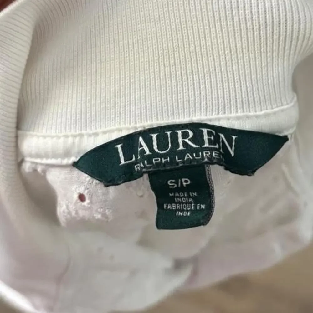 White eyelet polo top with